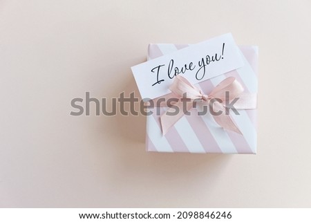 Valentine's Day background. Gifts, confetti, envelope on pastel background. Valentines day concept. Flat lay, top view, copy space