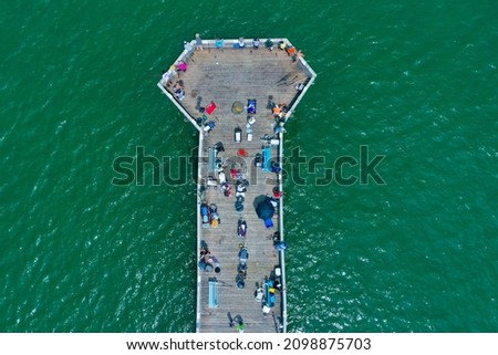 Aerial View top down of people fishing on the end of the Virginia Beach fishing pier