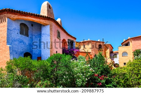 Beautiful colorful houses with nice garden, Porto Cervo, Sardinia, Italy Royalty-Free Stock Photo #209887975