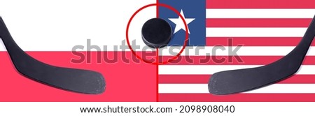 Top view hockey puck with Poland vs. Liberia command with the sticks on the flag. Concept hockey competitions
