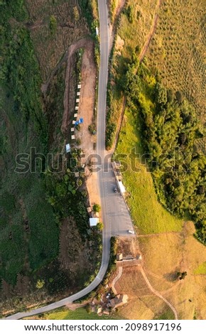 Mountain view point and road connecting countryside at northernmost part of Thailand aerial view from drone shot 