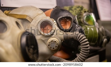 Different Set gas mask are in row on black background.