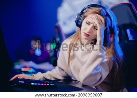 Facepalm streamer caucasian woman fail losing play gamer playing online video games computer emotions aggression, neon color.