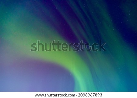 Arctic polar night starry sky background of aurora borealis and Northern Lights.