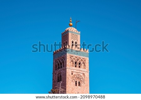 Koutoubia Mosque with traditional islamic ornament and decoration at minaret tower against clear blue sky Royalty-Free Stock Photo #2098970488