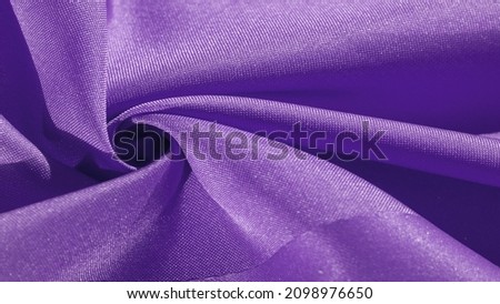 Silk fabric, Carolina blue. Folds in silky blue fabric, close-up, full frame