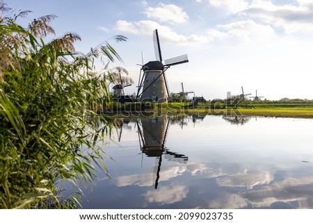 Horizontal picture of one of the famous Dutch windmills at Kinderdijk, a UNESCO world heritage site. On the photo is one mill of the 19 windmills at Kinderdijk, South Holland, the Netherlands, which