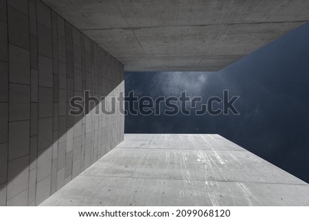 Abstract geometric shapes architecture background. Modern building details made in concrete. Exterior gray walls against dark blue sky. Straight lines. minimal, aesthetic, design concept. fragment 
