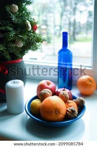 winter festive still life of apples orange nuts