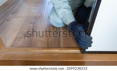 Workers inspecting wooden door rails. "Japanese fusuma" Royalty-Free Stock Photo #2099238253