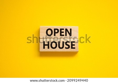 Time to open house symbol. Concept words Open house on wooden blocks on a beautiful yellow background. Business and time to open house concept. Copy space.