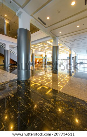 Perspective of the modern lobby, hallway of the luxury hotel, shopping mall, business center in Vancouver, Canada. Interior design. Vertical.