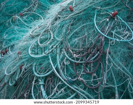 Close up of fishing nets in the harbour. Royalty-Free Stock Photo #2099345719