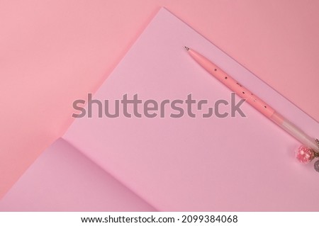 Making notes in pink notebook copy space . High quality photo