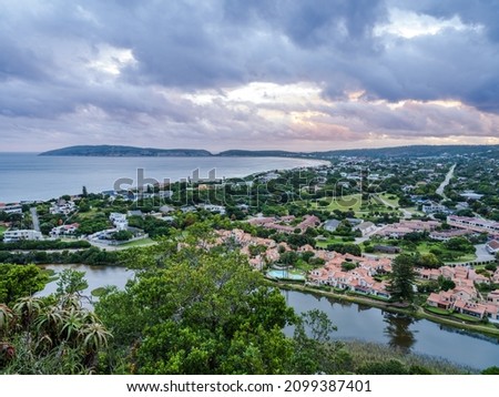 Aerial shot of Plettenberg Bay town from during a cloudy sunset in the Garden Route South Africa