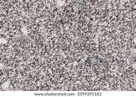 seamless mottled beige and black granite texture. stone surface. marbled wallpaper