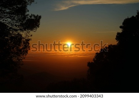 Sunset on the monastery mountain Santuari De Sant Salvador
