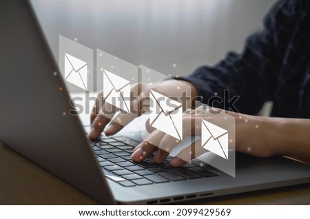 Businessman in email marketing concept The company's online presence informs its customers by email and digital newsletters via Internet messages.
