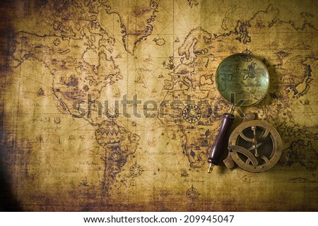 old map with compass and  Magnifier