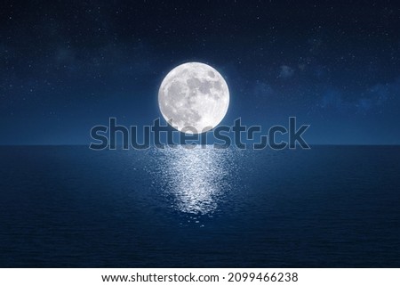 Full moon over the peaceful sea (Elements of the moon image furnished by NASA) Royalty-Free Stock Photo #2099466238