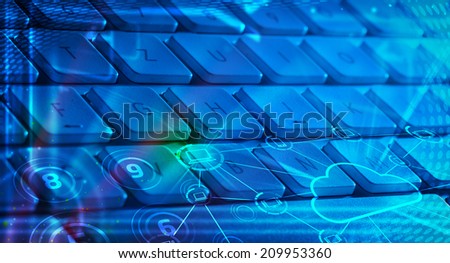 Computer keyboard with glowing cloud computing and multimedia icons