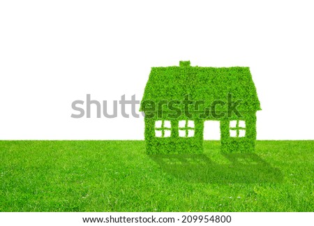 Green  house symbol on meadow on white background 