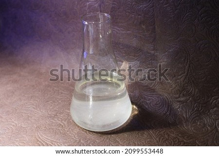Photo of laboratory flasks with poured in them: nitric, phosphoric, sulfuric acid, hydrochloric acid Royalty-Free Stock Photo #2099553448