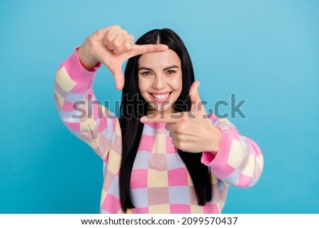Photo of excited funky lady dressed print pullover showing photo gesture isolated blue color background