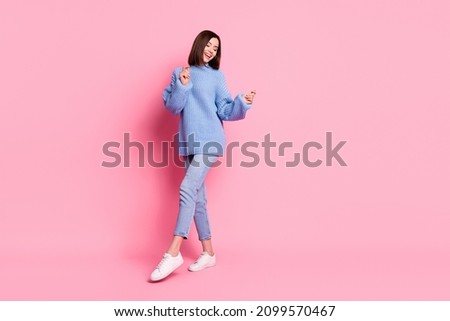 Full length body size view of attractive cheerful carefree brown-haired girl dancing moving isolated over pink pastel color background
