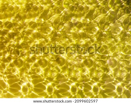 Yellow shiny texture - water background
