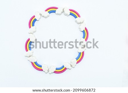 Rainbow Erasers with Smiling Clouds on White Background