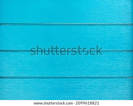 Light blue wood texture, wall background surface with a horizontal pattern. Vintage blue timber table top view.