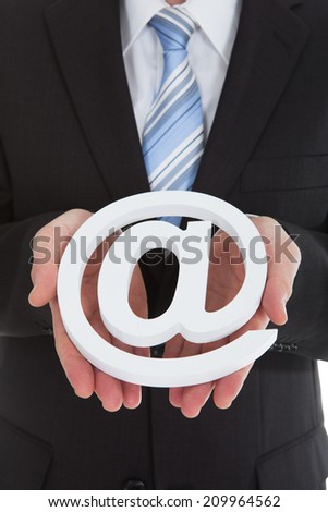 Midsection photo of businessman holding internet symbol