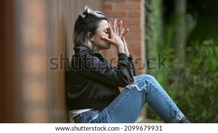 Woman feeling regret covering face with hand ashamed Royalty-Free Stock Photo #2099679931