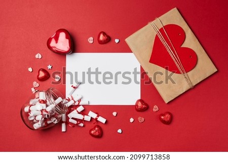 Valentines day gift on red background. Heart shape gift box with surprise. Love day concept. Anniversary, mothers day, womens day and birthday greeting