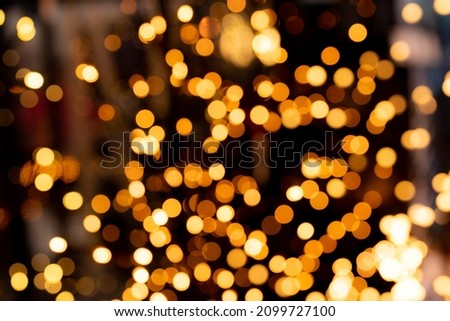 Round bokeh of Christmas illuminations, gold color