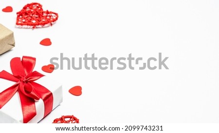 Valentines day background with hearts and gift box on white background. Copy space