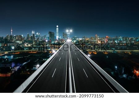 Top view of Highway overpass with beautiful city background. night scene