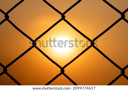 Beautiful sunset through the grid