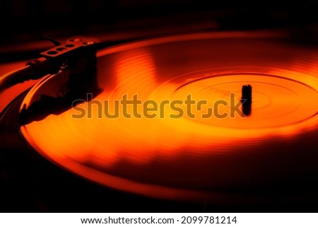 Vinyl Record spinning on turntable Royalty-Free Stock Photo #2099781214