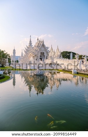 Chiang Rai Thailand, white temple Chiangrai during sunset, Wat Rong Khun, aka The White Temple, in Chiang Rai, Thailand. Panorama white temple Thailand Royalty-Free Stock Photo #2099816449