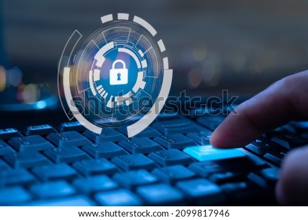 Finger press keyboard at the enter button on the computer with lock key hologram. Information technology security comcrpt. Royalty-Free Stock Photo #2099817946
