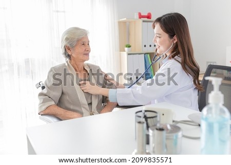 close up doctor, Asian doctor talk with old female patient about disease symptom, doctor use stethoscope listening lung of patient, elderly health check up, happiness hospital