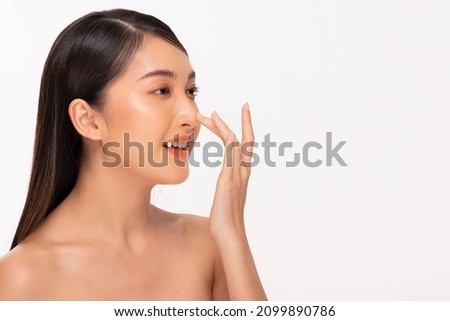 Beauty asian women  touching nose portrait face with natural skin and skin care healthy hair and skin close up face beauty portrait.Beauty Concept on white background. Royalty-Free Stock Photo #2099890786