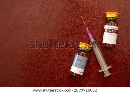 many cans of vaccine and syringes lie on the table in the hospital where they will do the vaccination. Concept of people who want to be vaccinated. Coronavirus pandemic
