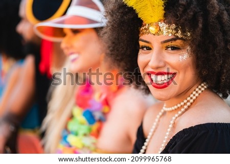 Carnaval in Brasil, portrait of pretty woman smiling at brazilian party in costume