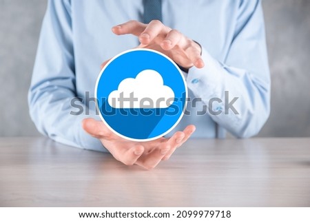 Businessman hold cloud icon.Cloud computing concept - connect smart phone to cloud. computing network information technologist with smart phone.Big data Concept.flat icons with long shadows.
