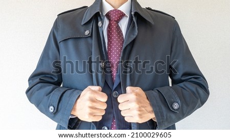 A businessman wearing a coat. Royalty-Free Stock Photo #2100029605