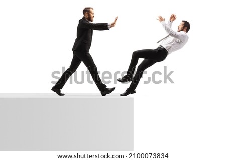 Full length profile shot of a businessman pushing a man from a wall isolated on white background Royalty-Free Stock Photo #2100073834