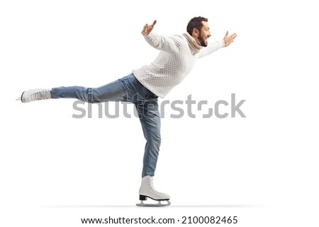 Full length profile shot of a man in jeans and white knitwear performing ice skating isolated on white background